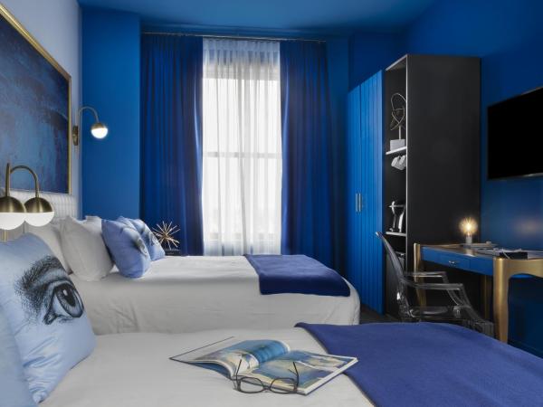 Angad Arts Hotel : photo 2 de la chambre chambre lit queen-size double - moyenne