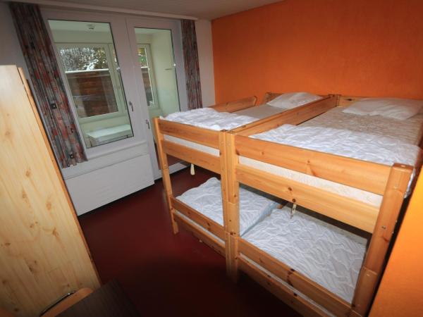 juhui Arosa : photo 3 de la chambre chambre quadruple avec salle de bains