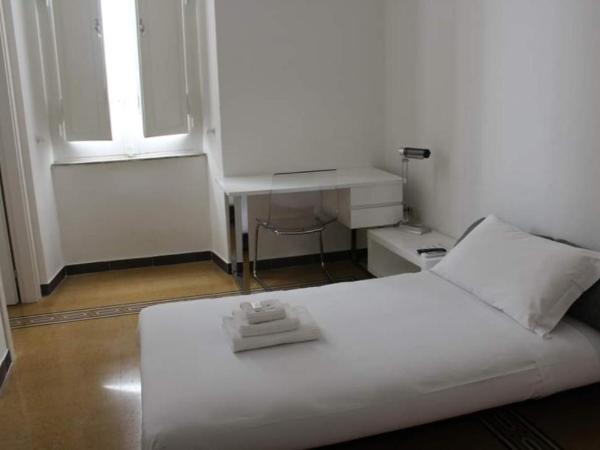Cagliari d'Amare Via Roma : photo 1 de la chambre chambre triple deluxe