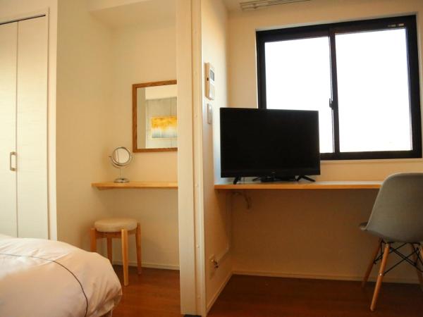 -Yoshitsuki kaku- Yoshitsuki Apart Hotel : photo 1 de la chambre chambre lit queen-size avec balcon