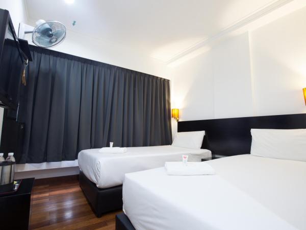 Tune Hotel - Waterfront Kuching : photo 4 de la chambre chambre lits jumeaux deluxe