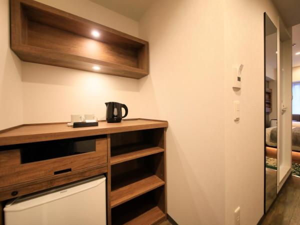 Quintessa Hotel Fukuoka Tenjin Minami : photo 1 de la chambre chambre lit jumeaux Économique avec canapé-lit - non-fumeurs