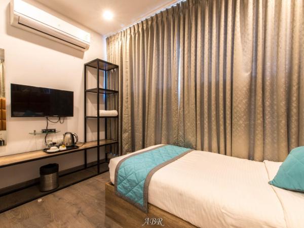 Caramel Hotels : photo 4 de la chambre chambre simple avec salle de bains privative