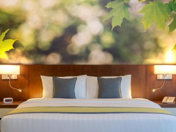 Wyndham Garden Muscat Al Khuwair : photo 1 de la chambre chambre lit king-size supérieure - non-fumeurs