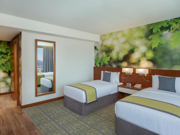 Wyndham Garden Muscat Al Khuwair : photo 2 de la chambre chambre lits jumeaux supérieure - non-fumeurs