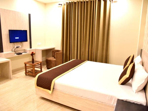 Hotel Triveni Residency : photo 2 de la chambre chambre lit king-size deluxe