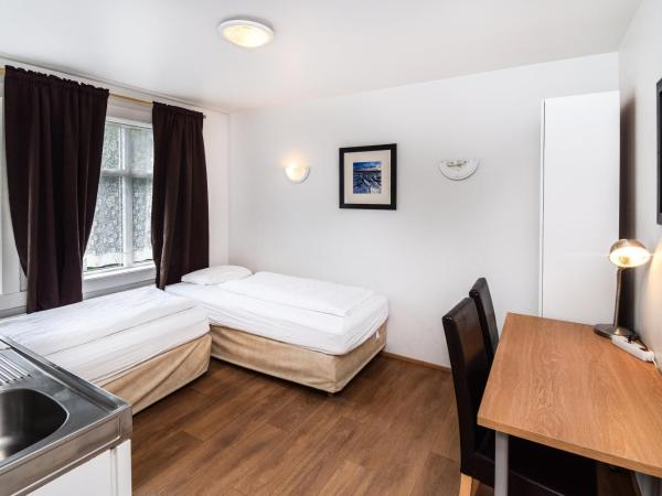 Guesthouse Andrea : photo 7 de la chambre chambre double ou lits jumeaux avec salle de bains commune