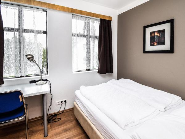 Guesthouse Andrea : photo 8 de la chambre chambre double ou lits jumeaux avec salle de bains commune