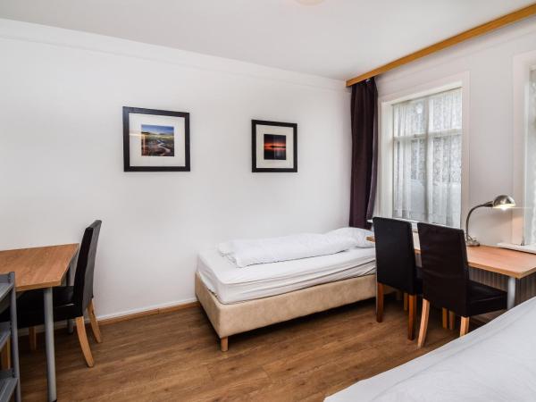 Guesthouse Andrea : photo 9 de la chambre chambre double ou lits jumeaux avec salle de bains commune