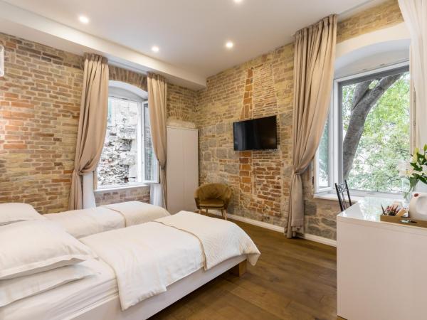 Pellegrini Luxury Rooms : photo 1 de la chambre chambre double ou lits jumeaux deluxe - vue sur ville