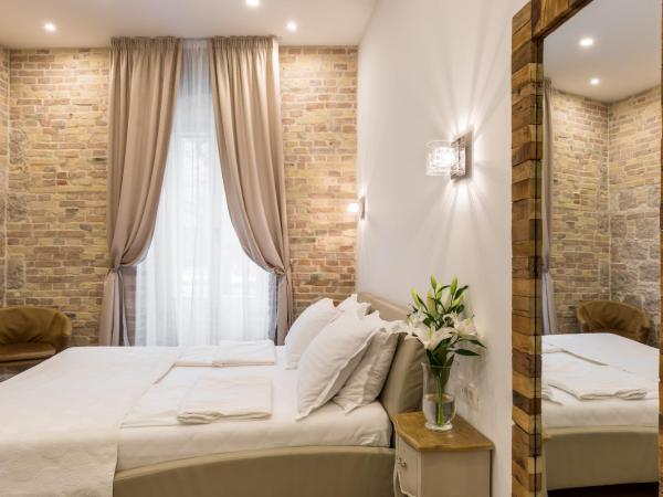 Pellegrini Luxury Rooms : photo 6 de la chambre chambre double deluxe - vue sur jardin