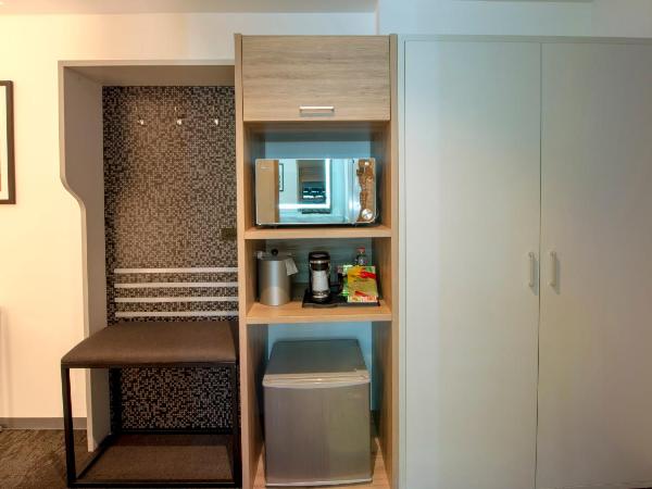 Holiday Inn & Suites - Merida La Isla, an IHG Hotel : photo 1 de la chambre chambre lit king-size premium