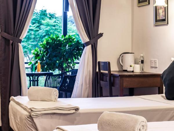 The Marian Boutique Lodging House : photo 1 de la chambre chambre lits jumeaux - vue sur piscine