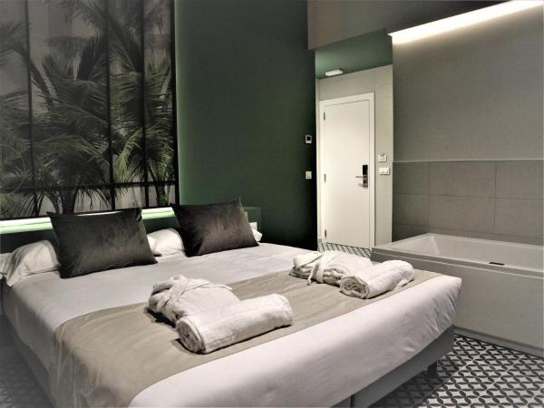 YOU & CO. Quart Boutique : photo 5 de la chambre chambre double de luxe avec baignoire spa 