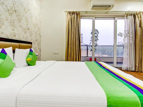 Treebo M2M Residency Sector 46 : photo 7 de la chambre chambre double deluxe