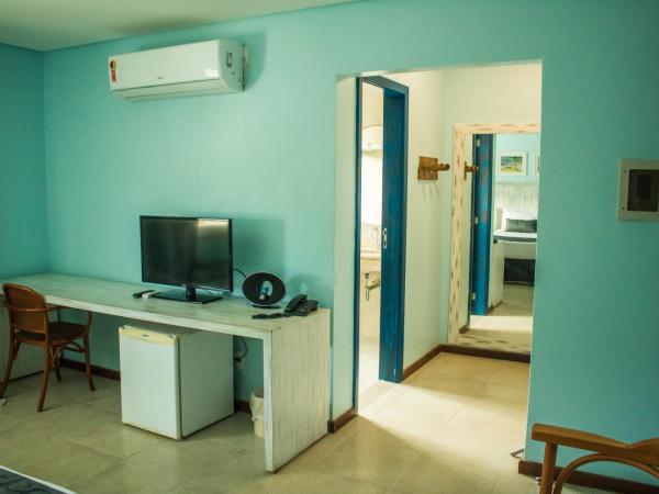 Farol de Itapuã Praia Hotel : photo 2 de la chambre chambre triple supérieure deluxe