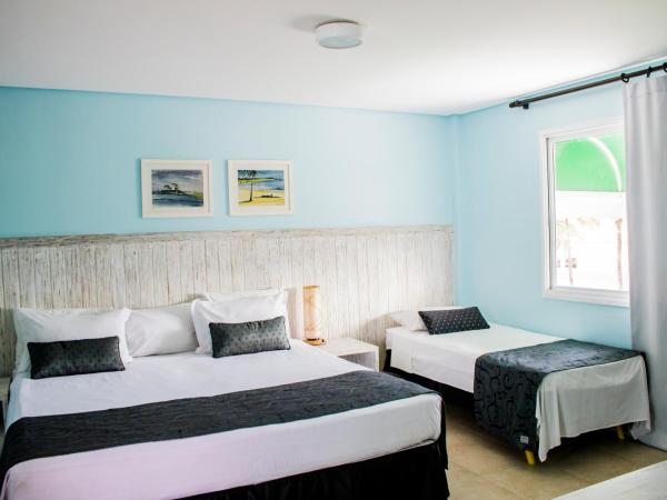 Farol de Itapuã Praia Hotel : photo 3 de la chambre chambre triple supérieure