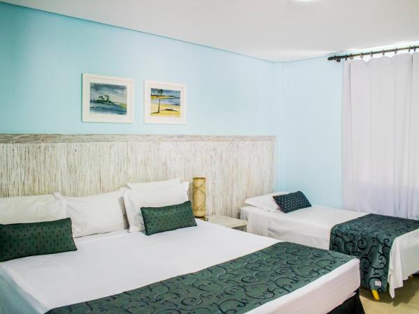 Farol de Itapuã Praia Hotel : photo 4 de la chambre chambre triple supérieure