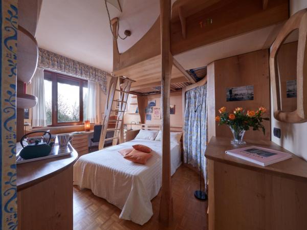 Le Balze Camere in Villa : photo 1 de la chambre chambre lit queen-size - vue sur jardin