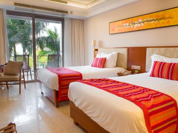 Sanya Seacube Holiday Hotel : photo 2 de la chambre chambre lit king-size ou lits jumeaux supérieure - vue sur jardin