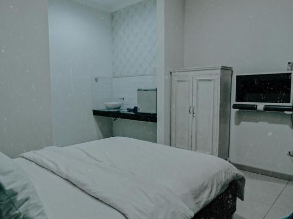 Griya Suryo Wijilan : photo 8 de la chambre chambre lit queen-size deluxe