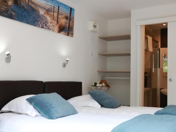 Reingam-Park : photo 1 de la chambre chambre lits jumeaux avec salle de bains