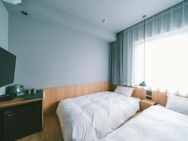 LANDABOUT TOKYO : photo 1 de la chambre petite chambre lits jumeaux.