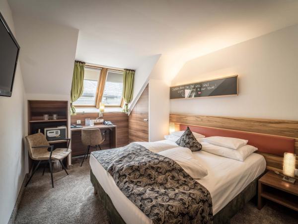 BEST WESTERN Plus Hotel Goldener Adler Innsbruck : photo 7 de la chambre chambre lits jumeaux classique