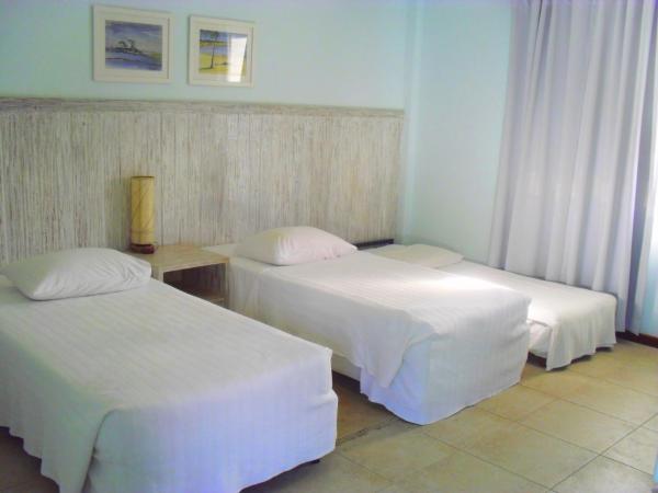 Farol de Itapuã Praia Hotel : photo 5 de la chambre chambre triple supérieure