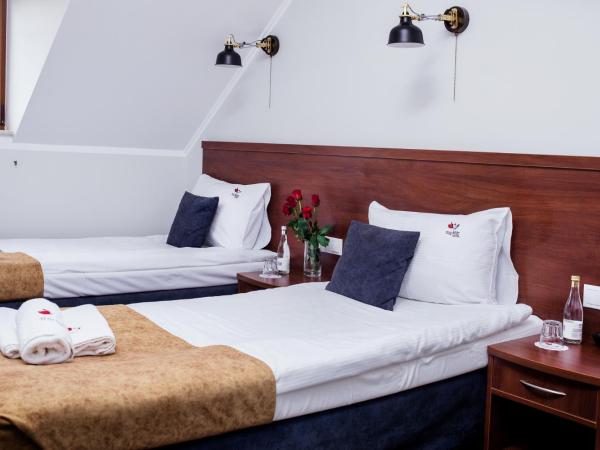 Hotel Trzy Róże : photo 3 de la chambre chambre lits jumeaux