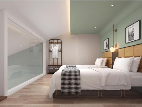 Happy Dragon City Culture Hotel-Tianjin Draum Tower & Dayuecheng shopping mall : photo 9 de la chambre chambre lits jumeaux deluxe