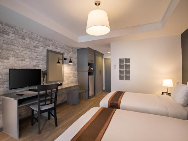 Journeyhub Pattaya Central : photo 3 de la chambre chambre lits jumeaux deluxe