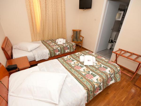 Cecil Hotel : photo 6 de la chambre chambre lits jumeaux