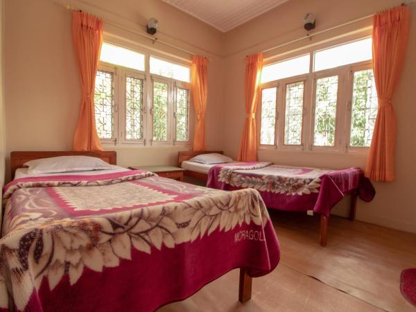 New Tourist Guest House : photo 2 de la chambre chambre lits jumeaux Économique