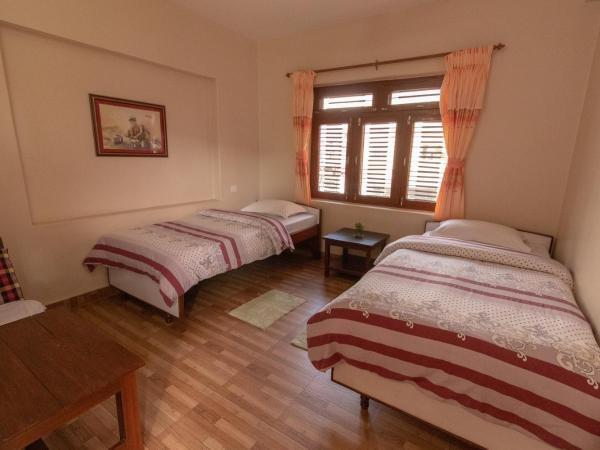 New Tourist Guest House : photo 2 de la chambre chambre lits jumeaux standard avec vue sur jardin