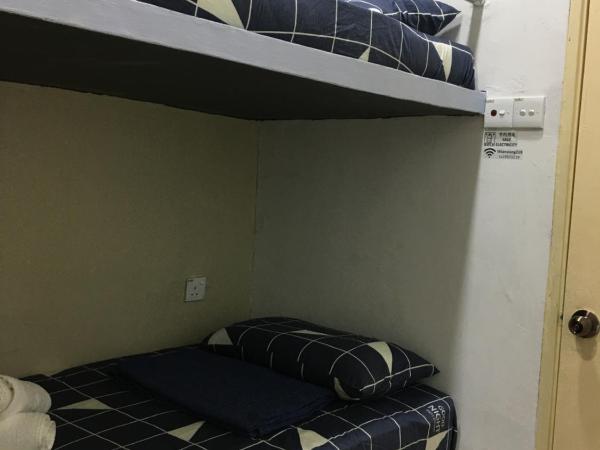 Thian Siong Inn : photo 2 de la chambre chambre lits jumeaux avec salle de bains commune