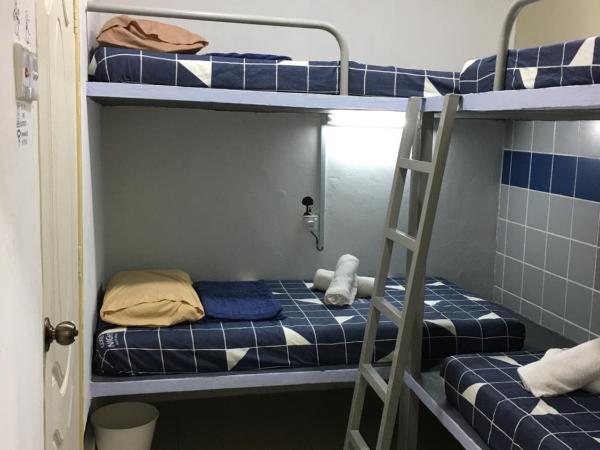 Thian Siong Inn : photo 1 de la chambre chambre quadruple avec salle de bains privative