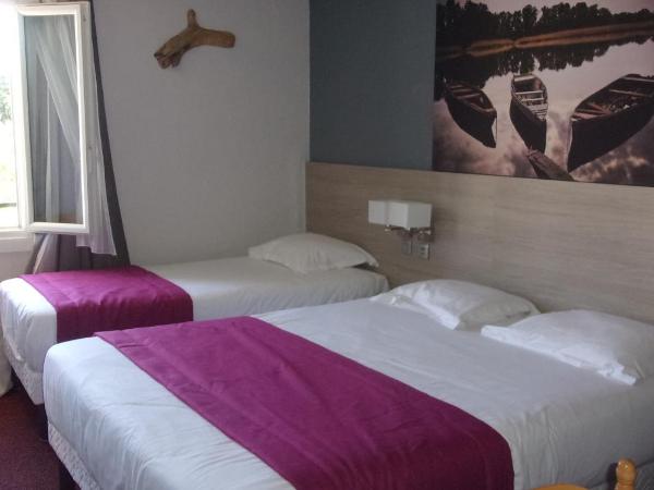 Atoll Hotel restaurant : photo 3 de la chambre chambre triple (1 lit double et 1 lit simple)