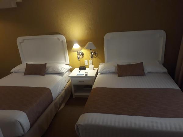 Country Plaza : photo 4 de la chambre chambre double avec 2 lits doubles