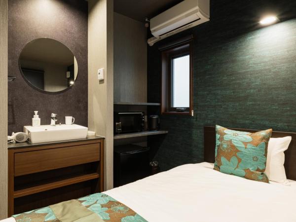 GRAND BASE Haruyoshi : photo 3 de la chambre chambre lits jumeaux standard
