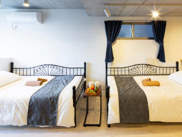 Laffitte Hirai Condominium Hotel : photo 9 de la chambre studio familial