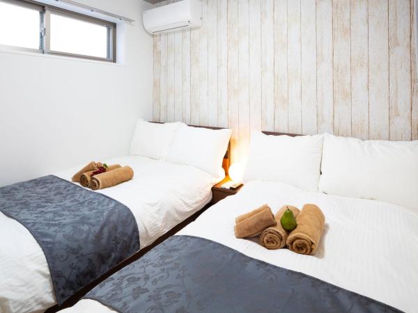 Laffitte Hirai Condominium Hotel : photo 7 de la chambre appartement en duplex