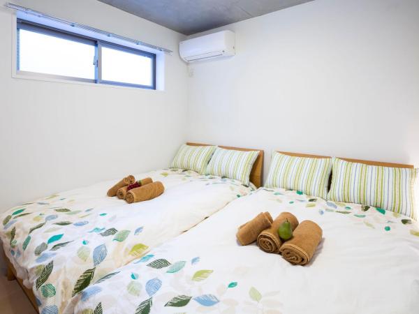 Laffitte Hirai Condominium Hotel : photo 5 de la chambre appartement en duplex