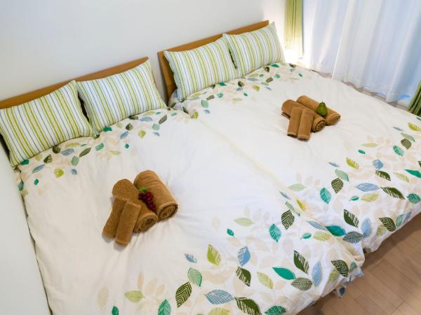 Laffitte Hirai Condominium Hotel : photo 4 de la chambre appartement en duplex