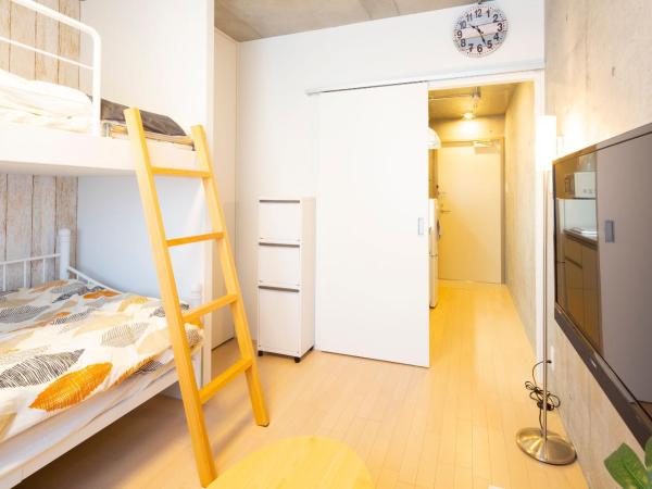 Laffitte Hirai Condominium Hotel : photo 4 de la chambre chambre triple