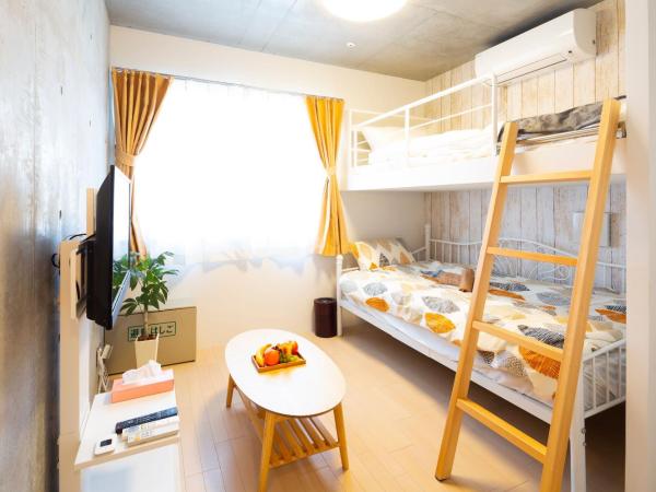 Laffitte Hirai Condominium Hotel : photo 1 de la chambre chambre triple