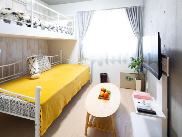 Laffitte Hirai Condominium Hotel : photo 10 de la chambre chambre triple