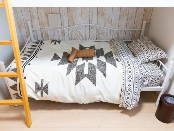 Laffitte Hirai Condominium Hotel : photo 8 de la chambre chambre triple