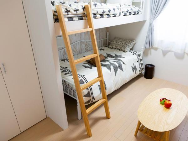 Laffitte Hirai Condominium Hotel : photo 5 de la chambre chambre triple