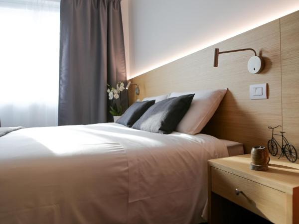 Bed and Bike Verona : photo 1 de la chambre grande chambre double ou lits jumeaux